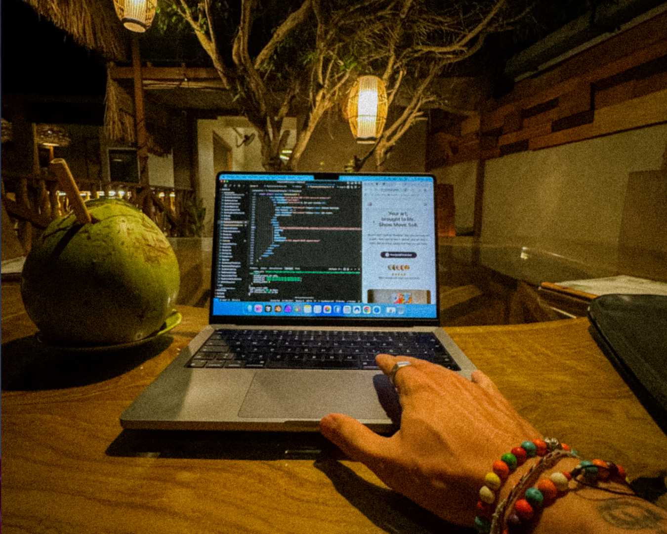 Laptop and ocean view from a coworking cafe in Kuta Lombok